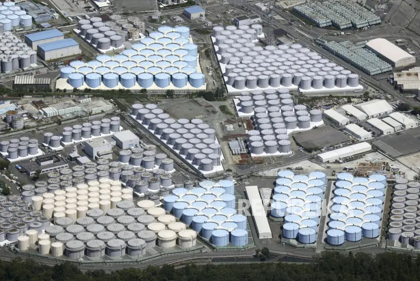 This aerial view shows the tanks which contain treated radioactive wastewater at the Fukushima Daiichi nuclear power plant in Fukushima northern Japan on Aug 22 2023 For the wrecked Fukushima Daiichi nuclear plant managing the ever growing radioactive water held in more than 1000 tanks has been a safety risk and a burden since the meltdown in March 2011 The start of treated wastewater release Thursday marked a milestone for the decommissioning which is expected to take decades